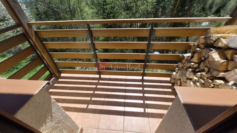 Balcony in a Recreational Apartment with Wooden Paneling and Firewood, Stará Lesná.