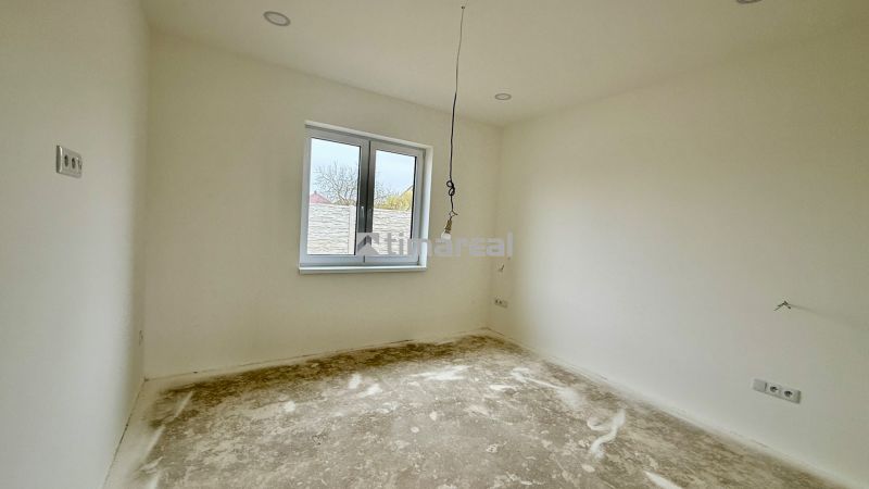 Interior in a family house with white walls and an empty floor with a wooden decor.