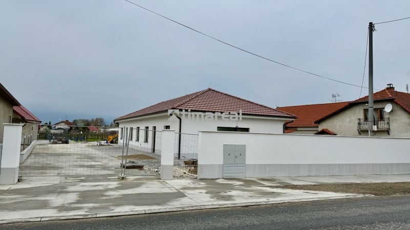 Family house on Hlavná Street in Vlčany, white facade, red roof.