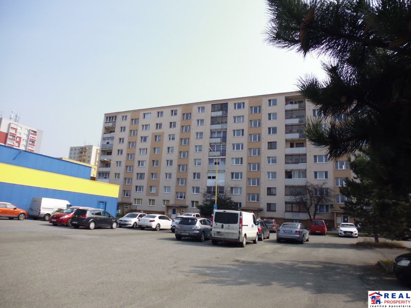Apartment building with parked cars on G. Svoboda Street in Prešov offers 2-room apartments.