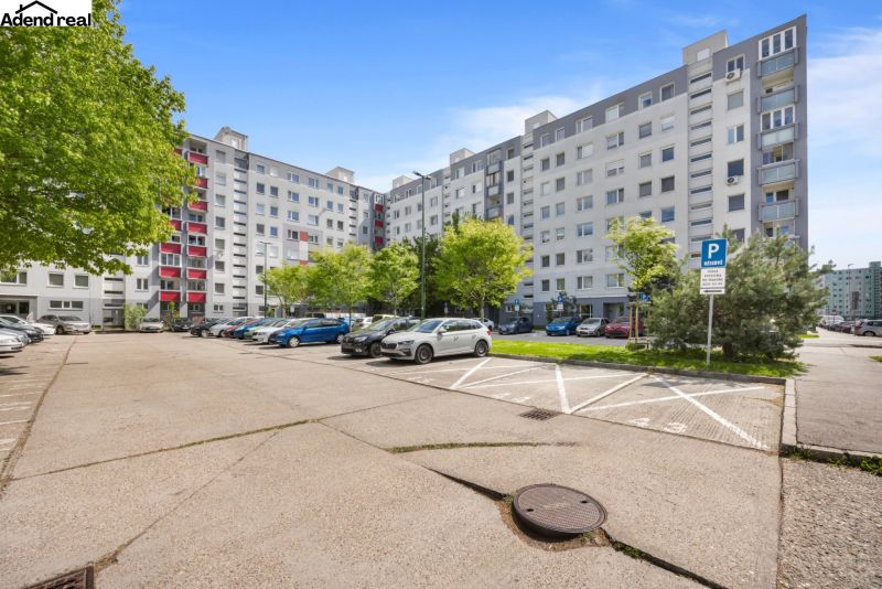 Parking lot in front of the apartment building on Kríkova Street in Bratislava, Vrakuňa.