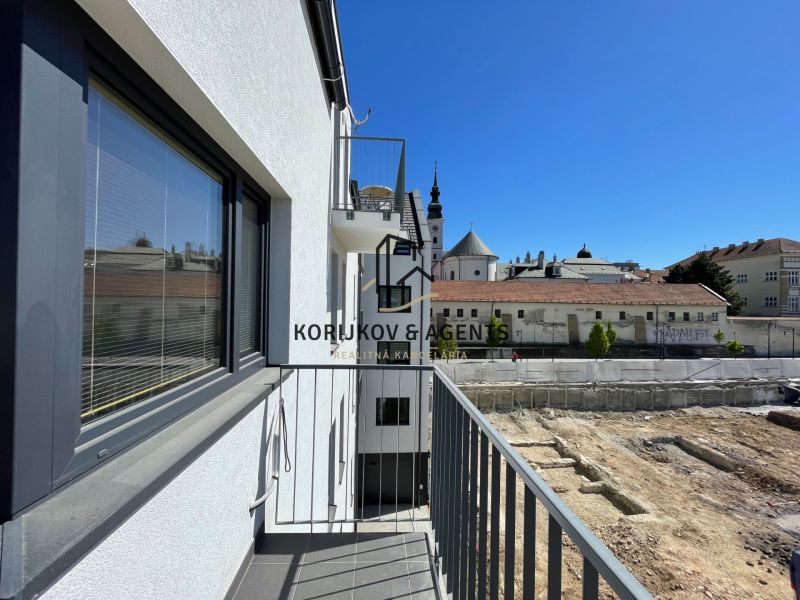 The balcony of a 2-room apartment on Jarková Street in Prešov with a view of the city skyline.