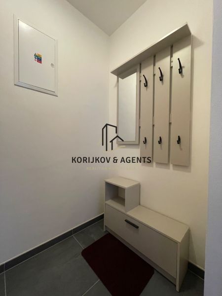 Hallway with a wardrobe and shoe cabinet in a 2-room apartment.