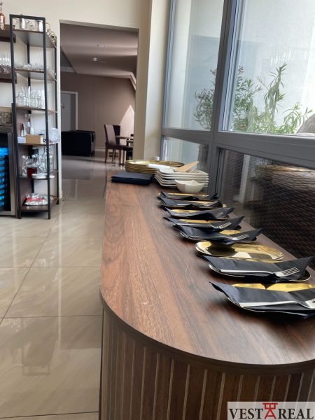 Gastro premises with prepared plates and cutlery on the floor with wooden decor.