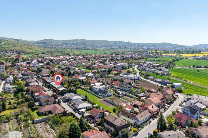 Aerial view of a neighborhood with family houses in Stupava on Hollého Street.