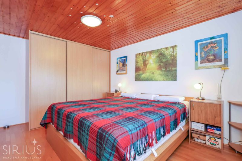 Bedroom in a family house with sliding wardrobe doors, decorated with ceiling stars.