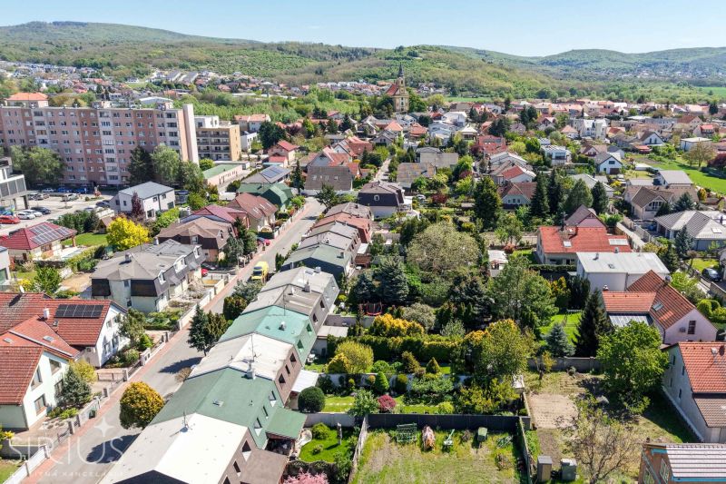 Aerial view of family houses on Hollého Street in Stupava with beautiful garden architecture.