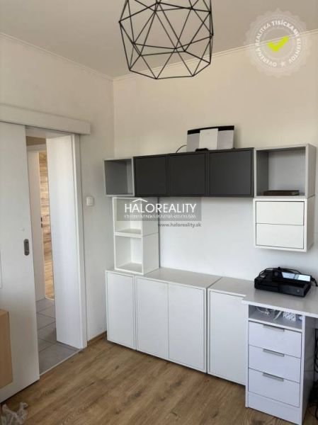 Interior of a family house with white and gray furniture, floor with wooden decor.