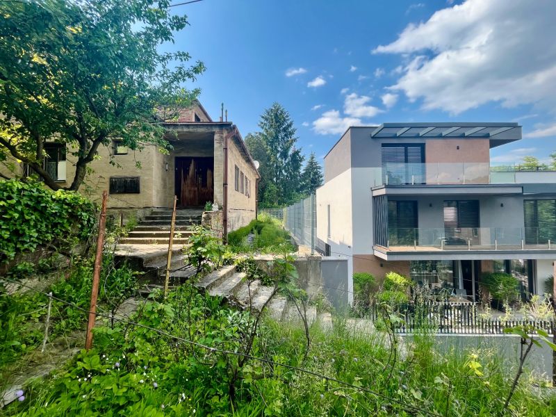 Family houses on Búdková Street in Bratislava - Staré Mesto surrounded by greenery and stairs.