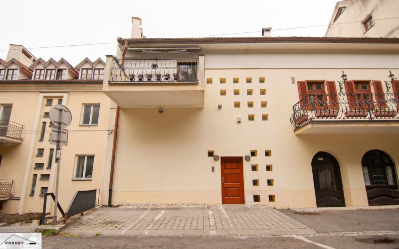 Beblavého, Bratislava - Staré Mesto: The facade of the building with balconies and a parking lot in front of the entrance.