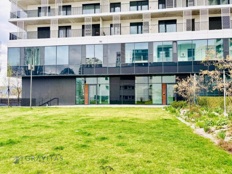 Building with a glass facade and lawn in Bratislava - Ružinov on Prístavná Street.