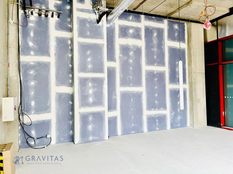 Future commercial spaces with raw walls and external cables, ready for modifications.