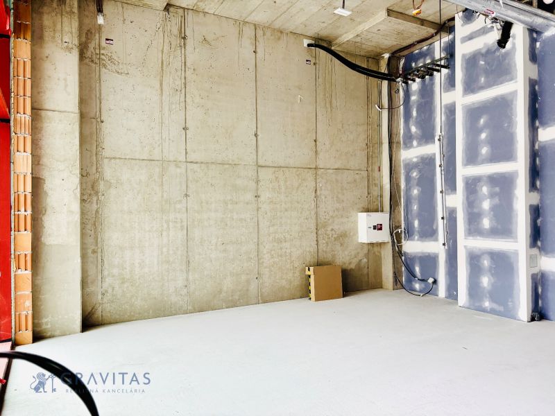 Concrete walls and electrical wiring in commercial spaces.