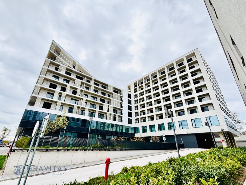 Modern apartment complex on Prístavná Street, Bratislava - Ružinov, surrounded by greenery.