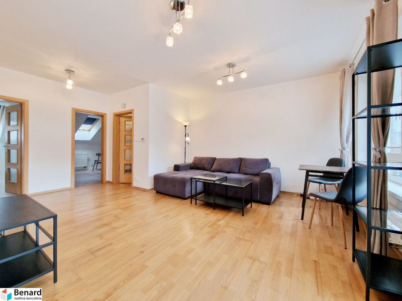 Living room with wood-patterned flooring, a sofa set, and a dining table in a three-room apartment.