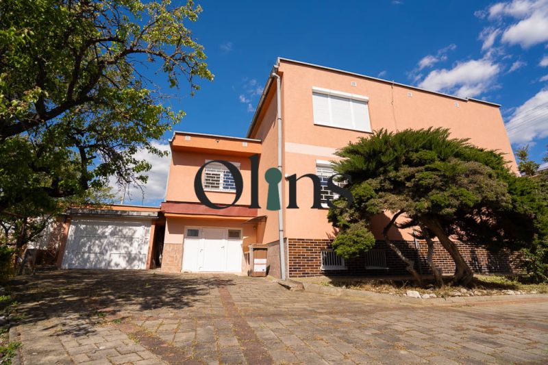 A family house on B.Tablica Street in Dudince with a garage and trees in the garden.