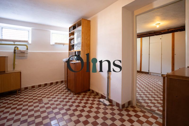 Interior of a family house with a tiled floor and wooden cabinets in Dudince, on B.Tablica.