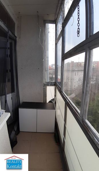 Glazed balcony in a 2-room apartment with a view in Nové Zámky, dresser, chain.