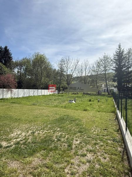 Plots - housing in Borinka with grassy vegetation and surroundings full of trees.