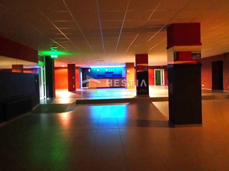 A commercial space with colorful lighting, ideal for business use and rental.