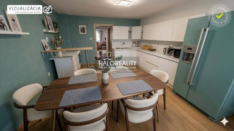 A kitchen in a family house with white cabinets, a wooden decor floor, and a dining table.