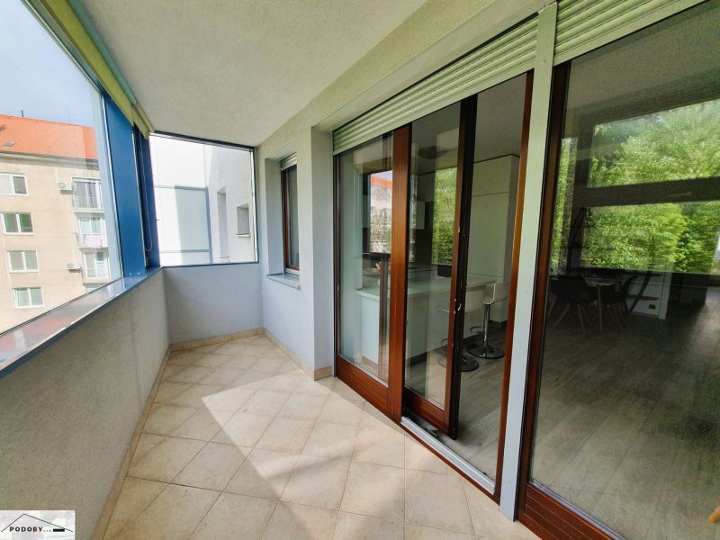 Glazed balcony with a view and entrance to a 3-room apartment.