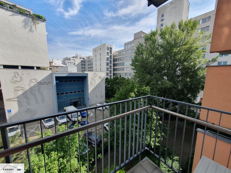 View from the balcony on Kováčska Street in Bratislava - Nové Mesto, surrounded by greenery.