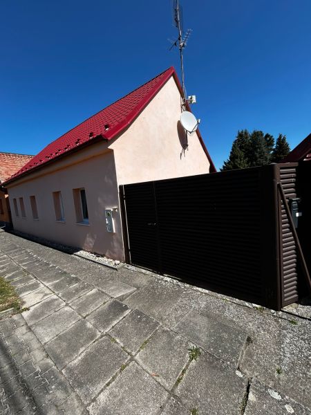 A family house on Mikulášov in Lakšárska Nová Ves with a red roof and a satellite.