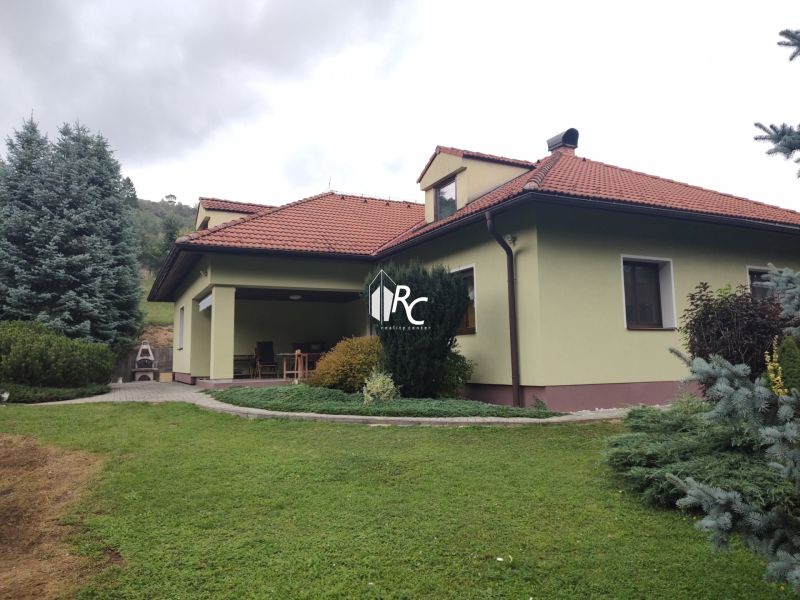 A family house in Trebostovo with a garden, lawn, terrace, and trees in the yard.