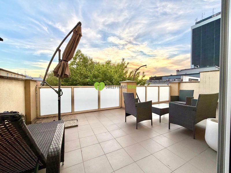A spacious terrace in a 3-room apartment on Jána Hollého in Michalovce with outdoor furniture.
