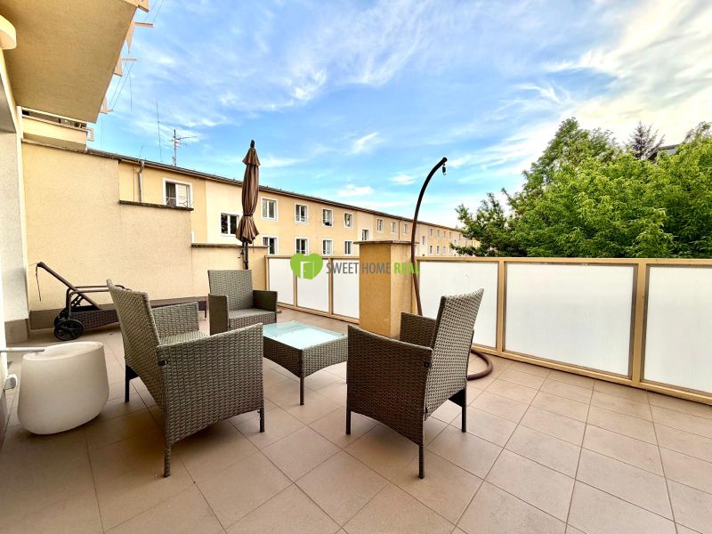 The atmosphere of a 3-room apartment on Jána Hollého in Michalovce with outdoor seating.