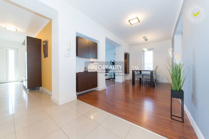 Family house with a wooden decor floor, bright interior, and modern furniture.