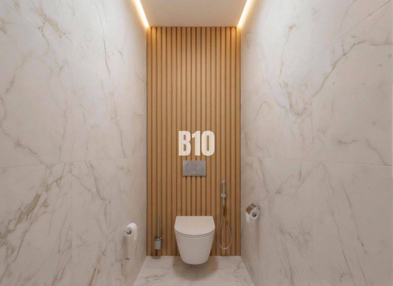 A bathroom in a 4-room apartment with marble tiles and wooden decor on the wall.
