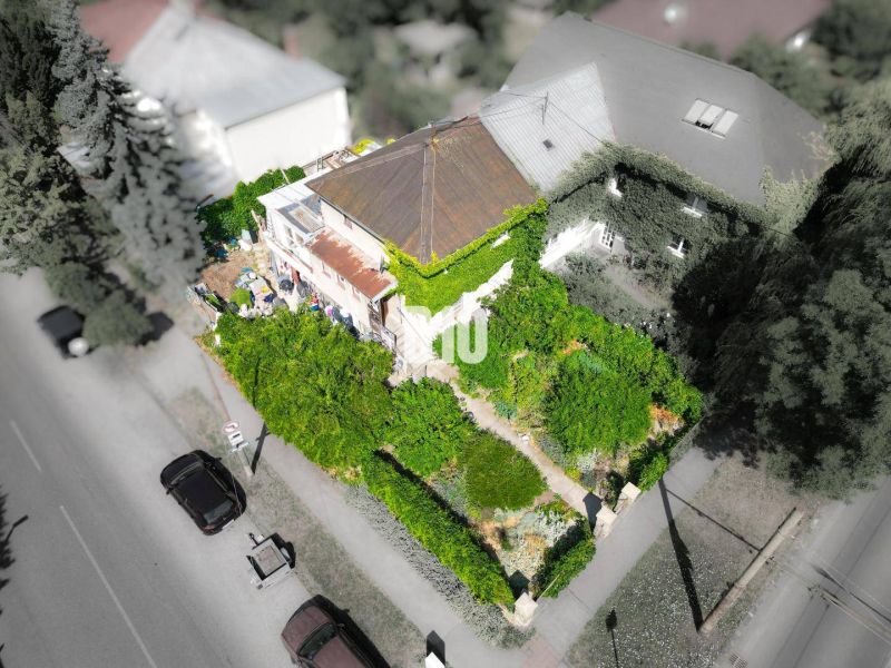 A family house in Bratislava - Staré Mesto surrounded by dense greenery and trees.