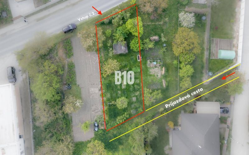 Aerial view of a residential plot in Dunajská Lužná with an access road.