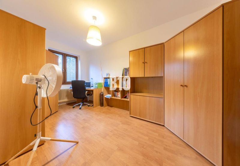 A room in a family house with wooden furniture and a wooden decor floor.