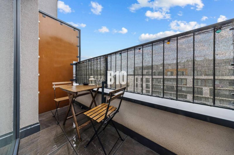 The balcony in the 1-room apartment offers a view of Zuzany Chalupovej Street in Bratislava V.