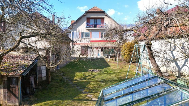 A family house in Turany with a spacious garden, greenhouse, and swing.