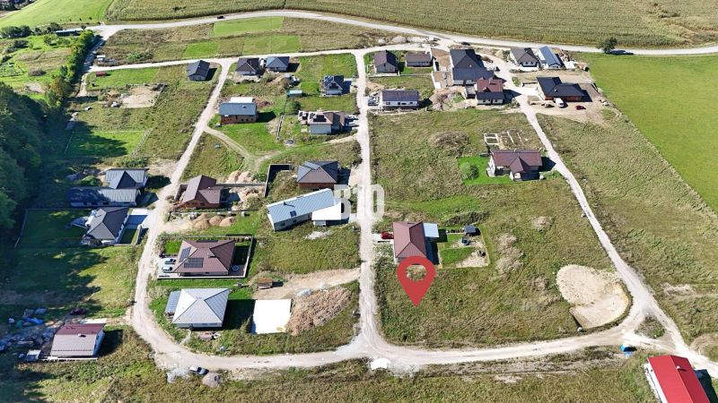 Aerial view of developing residential land in Necpaly with building plots.