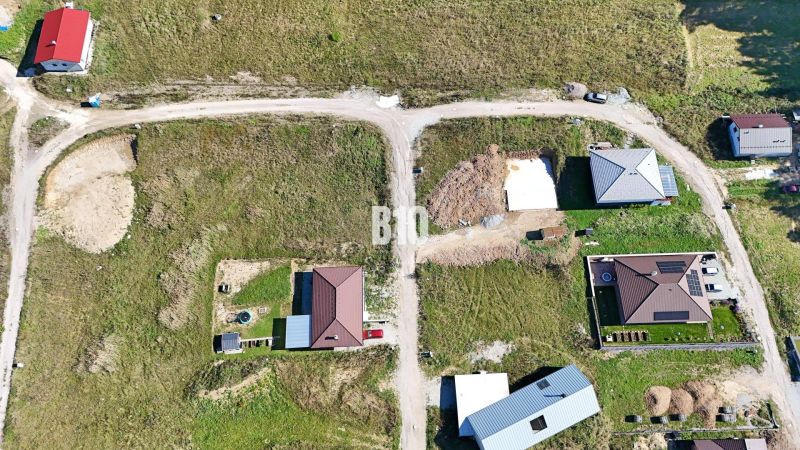 Aerial view of properties - housing in Necpaly with visible new house constructions.