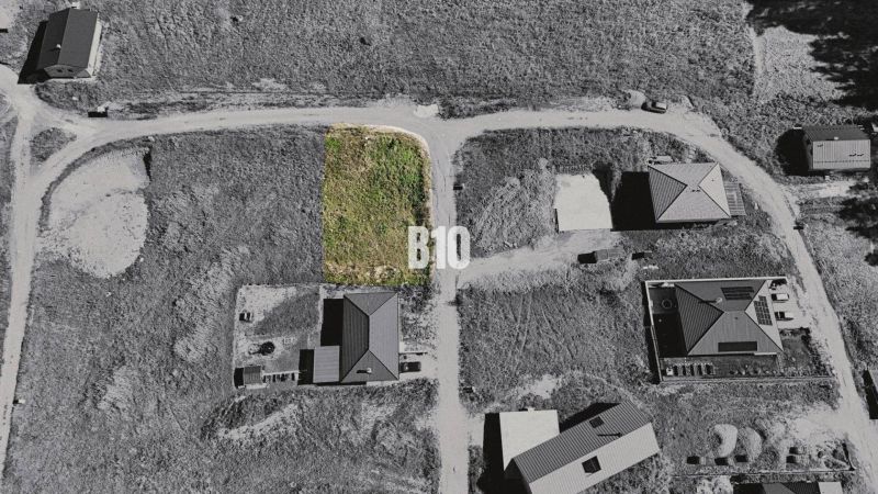 Aerial view of a building plot in Necpaly designated for residential use.
