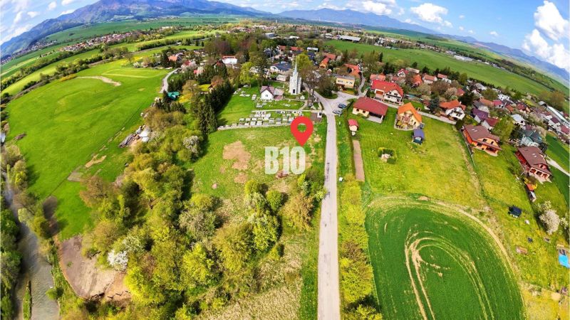 Aerial view of a rural residential area with a natural environment and scattered houses.