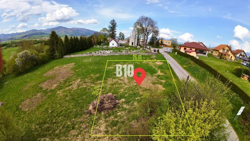 A plot ideal for living, surrounded by greenery, close to the church and homes, with a view of the mountains.