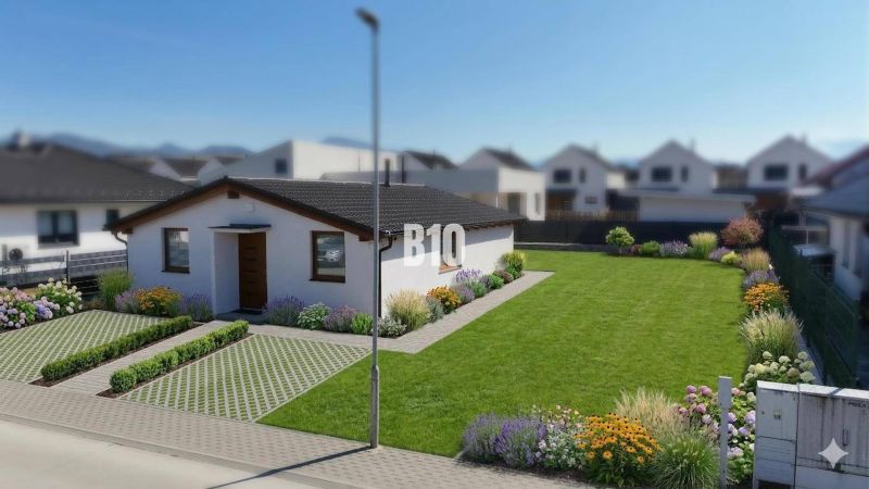 A family house in Diaková with a large garden, parking, and flower beds.