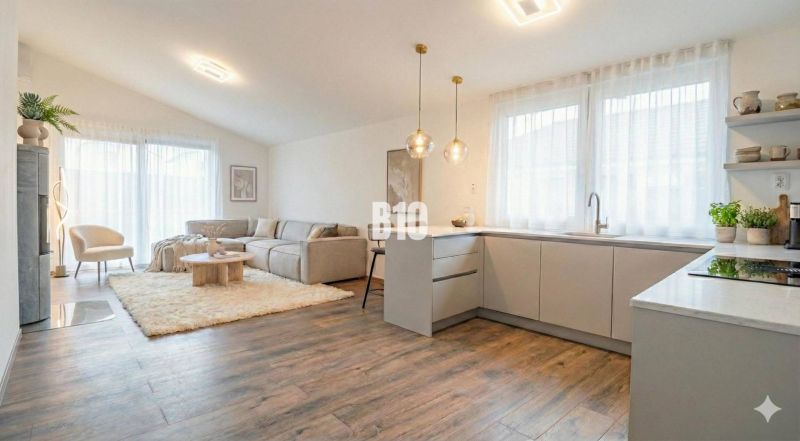 Interior of a family house with a bright kitchen, living room, and wooden decor flooring.