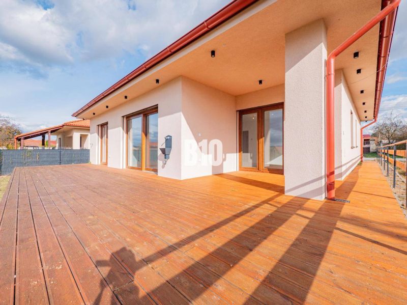 A family house in Beladice with a terrace and a wooden decor floor.