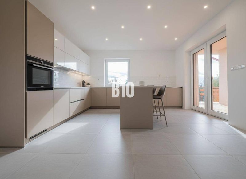 Kitchen in a family house with an island and bar stools.
