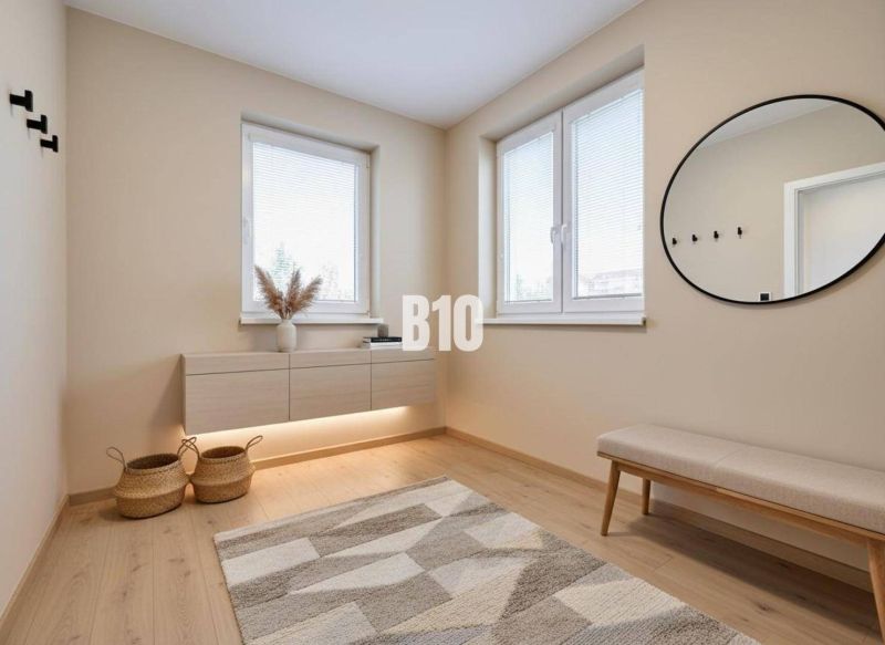 Interior of a family house with a bench, a round mirror, and a floor with a wooden decor.