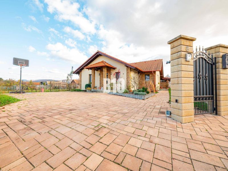 A family house in Nitra with a spacious yard and a basketball hoop in front of the entrance gate.