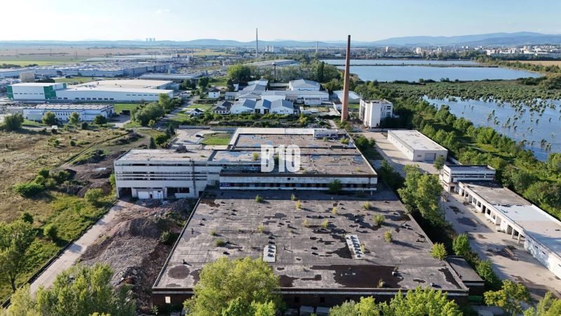 Production facilities in Levice surrounded by greenery and an industrial zone.